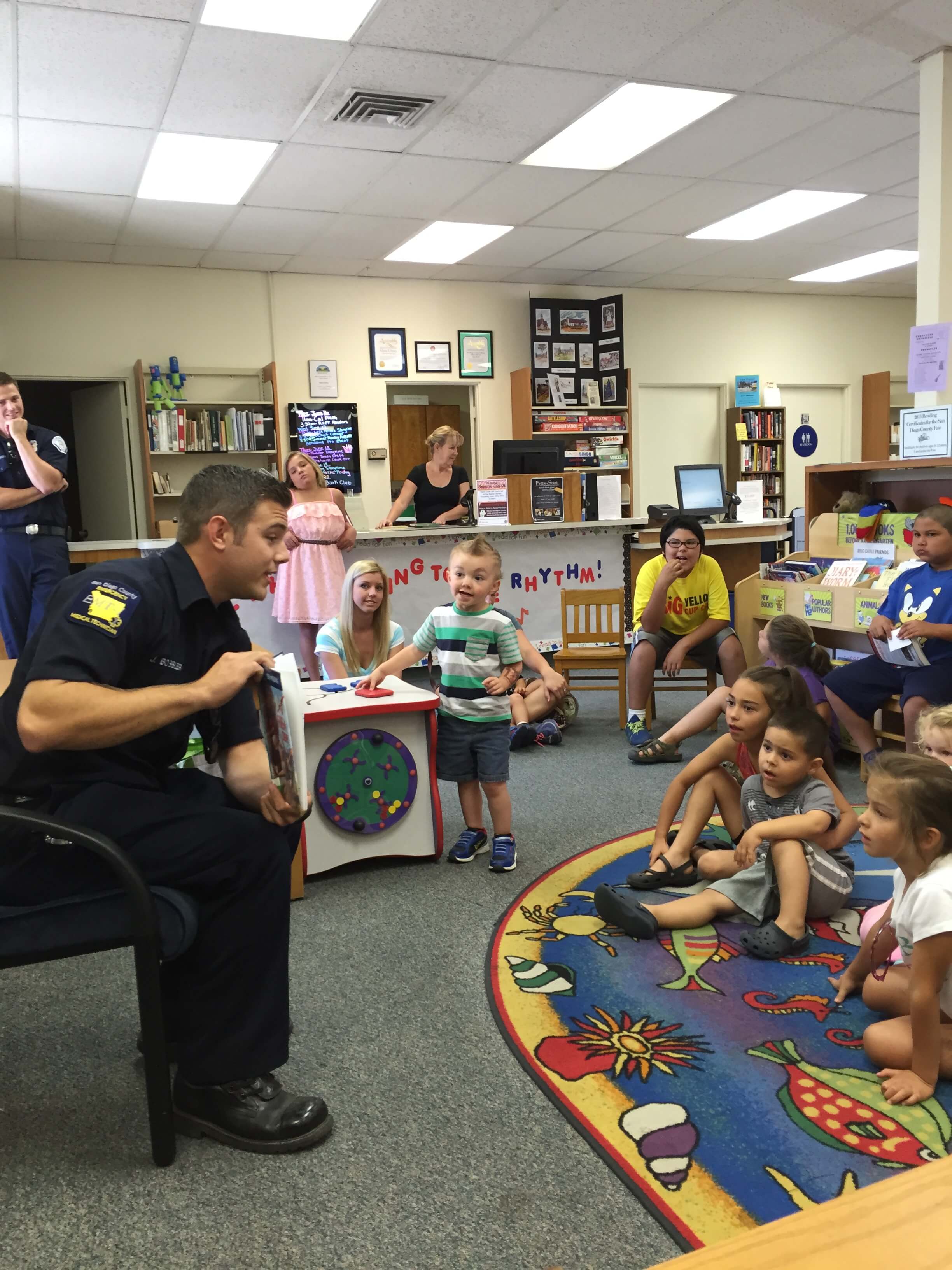 Mercy Medical Transportation crew teaching CPR to children at a community event