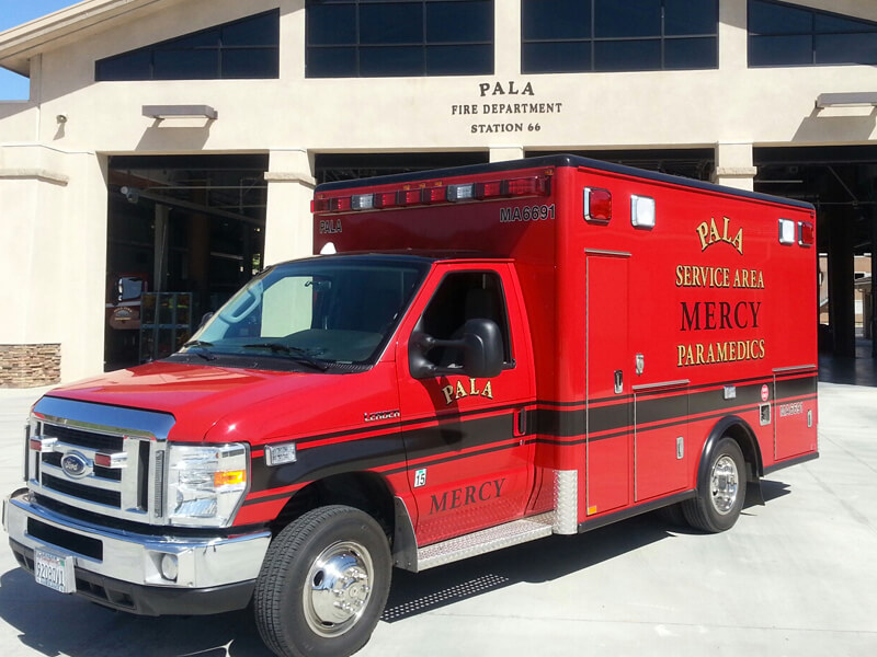 Mercy Medical Transportation ambulance at a fire station